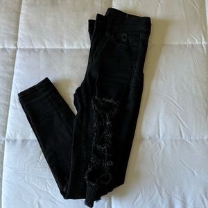 Black, ripped mid rise skinny jeans!